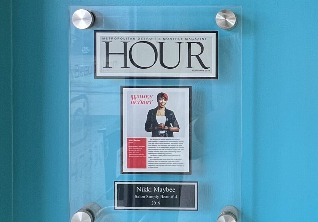 A clear plaque with the word " hour ".